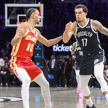 Oct 29, 2025; Brooklyn, New York, USA; Brooklyn Nets forward Michael Porter Jr. (17) looks to drive past Atlanta Hawks forward Zaccharie Risacher (10) in the second quarter at Barclays Center. Mandatory Credit: Wendell Cruz-Imagn Images