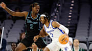 Mar 15, 2025; Fort Worth, TX, USA; Memphis Tigers guard Colby Rogers (3) controls the ball as Tulane Green Wave guard Kam Williams (3) defends during the first half at Dickies Arena.