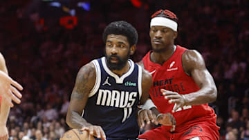 Nov 24, 2024; Miami, Florida, USA;  Miami Heat forward Jimmy Butler (22) defends Dallas Mavericks guard Kyrie Irving (11) during overtime at Kaseya Center. Mandatory Credit: Rhona Wise-Imagn Images