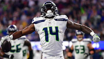Dec 4, 2022; Inglewood, California, USA; Seattle Seahawks wide receiver DK Metcalf (14) celebrates his touchdown scored against the Los Angeles Rams during the second half at SoFi Stadium. Mandatory Credit: Gary A. Vasquez-Imagn Images