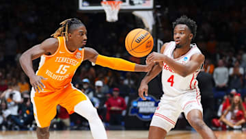 Houston guard L.J. Cryer (4) moves the ball while defended by Tennessee guard Jahmai Mashack (15) in the NCAA Tournament Elite Eight game at Lucas Oil Stadium in Indianapolis.