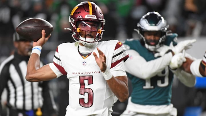 Nov 14, 2024; Philadelphia, Pennsylvania, USA; Washington Commanders quarterback Jayden Daniels (5) throws a pass during the fourth quarter against the Philadelphia Eagles at Lincoln Financial Field. Mandatory Credit: Eric Hartline-Imagn Images
