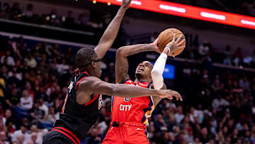 Oct 23, 2024; New Orleans, Louisiana, USA;  New Orleans Pelicans guard Dejounte Murray (5) shoots a jump shot against Chicago Bulls forward Jalen Smith (7) during the second half at Smoothie King Center. Mandatory Credit: Stephen Lew-Imagn Images