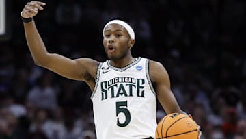 Mar 23, 2025; Cleveland, OH, USA; Michigan State Spartans guard Tre Holloman (5) dribbles in the first half against the New Mexico Lobos during the NCAA Tournament Second Round at Rocket Arena. Mandatory Credit: Rick Osentoski-Imagn Images
