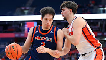 Bucknell Bison center Noah Williamson (3) drives against Syracuse Orange forward Petar Majstorovic (right) during the second half at the JMA Wireless Dome.
