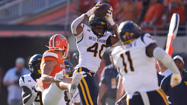 West Virginia Mountaineers linebacker Josiah Trotter (40) intercepts a pass during a college football game between the Oklahoma State Cowboys (OSU) and the West Virginia Mountaineers at Boone Pickens Stadium in Stillwater, Okla., Saturday, Oct. 5, 2024. West Virginia Mountaineers linebacker Josiah Trotter (40) intercepts a pass during a college football game between the Oklahoma State Cowboys (OSU) and the West Virginia Mountaineers at Boone Pickens Stadium in Stillwater, Okla., Saturday, Oct. 5, 2024.