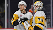 Jan 8, 2024; Philadelphia, Pennsylvania, USA; Pittsburgh Penguins defenseman Chad Ruhwedel (2) and goaltender Alex Nedeljkovic (39) celebrate win   against the Philadelphia Flyers at Wells Fargo Center. Mandatory Credit: Eric Hartline-Imagn Images