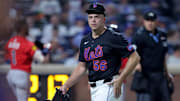 Aug 14, 2025; New York City, New York, USA; New York Mets relief pitcher Ryan Helsley (56) reacts as he walks off the field after the top of the eighth inning against the Atlanta Braves at Citi Field. Mandatory Credit: Brad Penner-Imagn Images