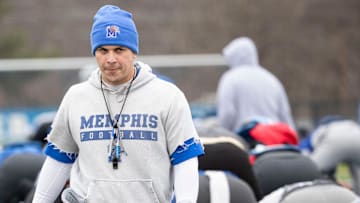 Tony Tokarz walks between rows of players as they warm up Tuesday, Dec. 17, 2019, during a practice at University of Memphis' Billy J Murphy Athletic Complex.