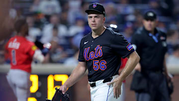 Aug 14, 2025; New York City, New York, USA; New York Mets relief pitcher Ryan Helsley (56) reacts as he walks off the field after the top of the eighth inning against the Atlanta Braves at Citi Field. Mandatory Credit: Brad Penner-Imagn Images