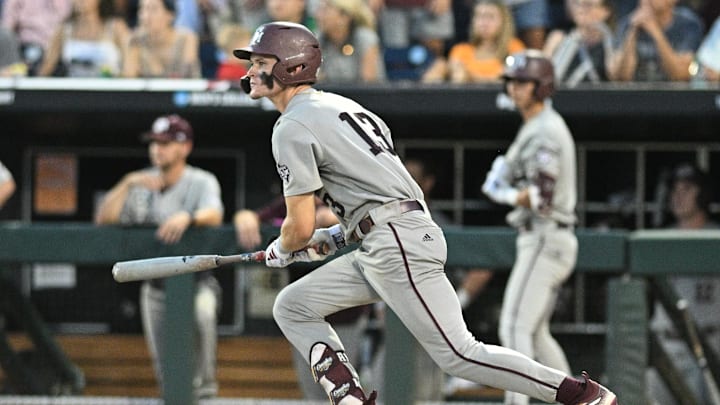 Jun 24, 2024; Omaha, NE, USA;  Texas A&M Aggies left fielder Caden Sorrell (13) doubles in a run against the Tennessee Volunteers during the eighth inning at Charles Schwab Field Omaha. Mandatory Credit: Steven Branscombe-Imagn Images
