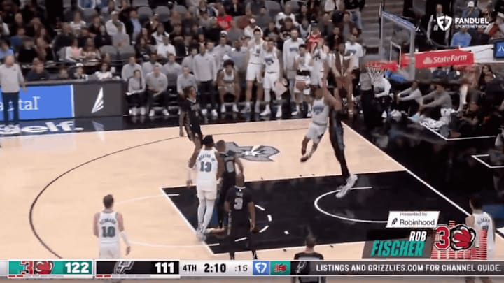 Ja Morant dunks on Victor Wembanyama after the whistle was blown in the Grizzlies-Spurs game Wednesday.