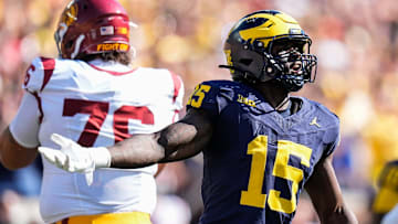 Michigan linebacker Ernest Hausmann (15) celebrates a tackle against USC during the first half at Michigan Stadium in Ann Arbor on Saturday, Sept. 21, 2024.