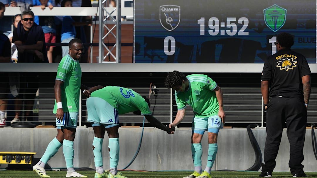Mar 15, 2026; San Jose, California, USA; Seattle Sounders midfielder Paul Rothrock (14) celebrates with forward Georgi Minoungou (center left) after scoring a goal against the San Jose Earthquakes during the first half at PayPal Park. Mandatory Credit: Darren Yamashita-Imagn Images Mar 15, 2026; San Jose, California, USA; Seattle Sounders midfielder Paul Rothrock (14) celebrates with forward Georgi Minoungou (center left) after scoring a goal against the San Jose Earthquakes during the first half at PayPal Park. Mandatory Credit: Darren Yamashita-Imagn Images