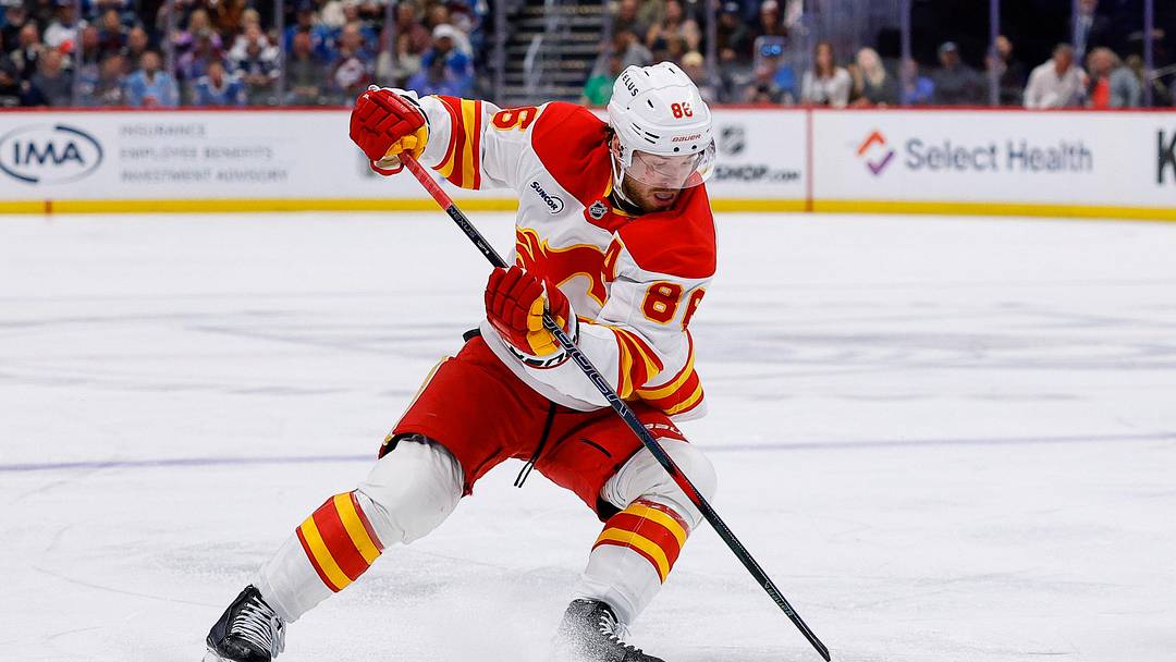 Apr 9, 2026; Denver, Colorado, USA; Calgary Flames left wing Joel Farabee (86) controls the puck in the third period against the Colorado Avalanche at Ball Arena. Mandatory Credit: Isaiah J. Downing-Imagn Images