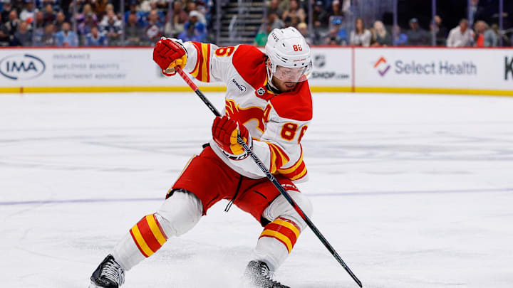 Apr 9, 2026; Denver, Colorado, USA; Calgary Flames left wing Joel Farabee (86) controls the puck in the third period against the Colorado Avalanche at Ball Arena. Mandatory Credit: Isaiah J. Downing-Imagn Images