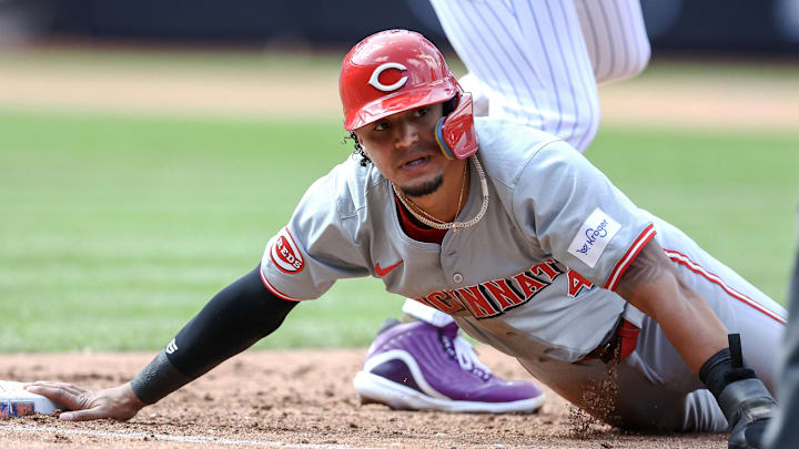 Sep 8, 2024; New York City, New York, USA;  Cincinnati Reds designated hitter Santiago Espinal (4) is picked off at first base in the fifth inning against the New York Mets at Citi Field. Mandatory Credit: Wendell Cruz-Imagn Images