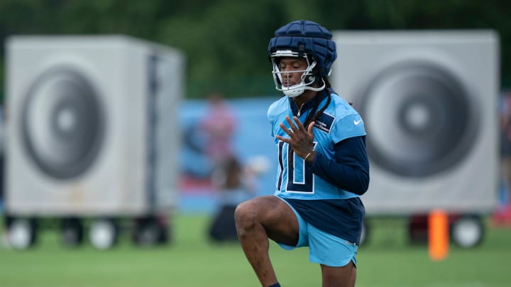 Tennessee Titans receiver DeAndre Hopkins (100 stretches between plays on the first day of training camp at Ascension Saint Thomas Sports Park Wednesday, July 24, 2024.