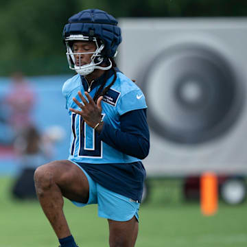 Tennessee Titans receiver DeAndre Hopkins (100 stretches between plays on the first day of training camp at Ascension Saint Thomas Sports Park Wednesday, July 24, 2024.