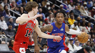 Feb 2, 2025; Detroit, Michigan, USA; Detroit Pistons forward Ronald Holland II (00) dribbles defended by Chicago Bulls forward Matas Buzelis (14) in the second half at Little Caesars Arena. Mandatory Credit: Rick Osentoski-Imagn Images
