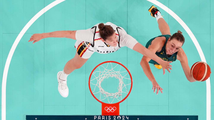 Aug 11, 2024; Paris, France; Australia forward Alanna Smith (11) shoots the ball against Belgium centre Kyara Linskens (13) in the women's basketball bronze medal game during the Paris 2024 Olympic Summer Games at Accor Arena. Mandatory Credit: Kyle Terada-USA TODAY Sports