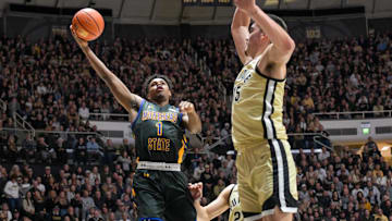 Nov 10, 2023; West Lafayette, Indiana, USA; Morehead State Eagles guard Jerone Morton (1) shoots the ball in front of Purdue Boilermakers center Zach Edey (15) during the fist half at Mackey Arena. Mandatory Credit: Marc Lebryk-Imagn Images