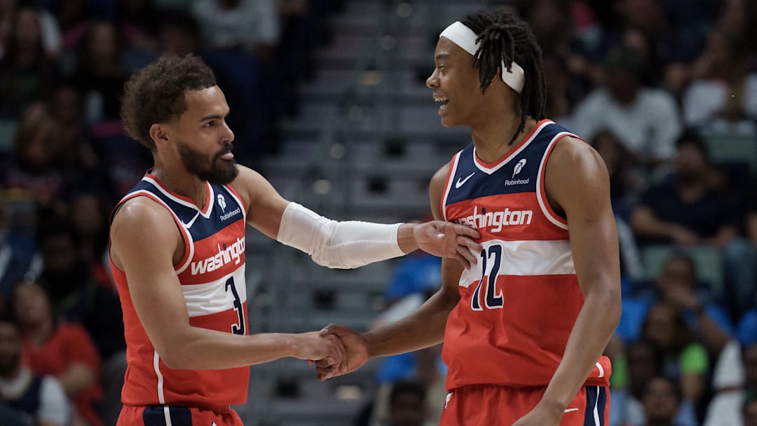 Mar 8, 2026; New Orleans, Louisiana, USA; Washington Wizards guard Trae Young (3) celebrates with guard Tre Johnson (12) during the first half against the New Orleans Pelicans at Smoothie King Center. Mandatory Credit: Matthew Hinton-Imagn Images