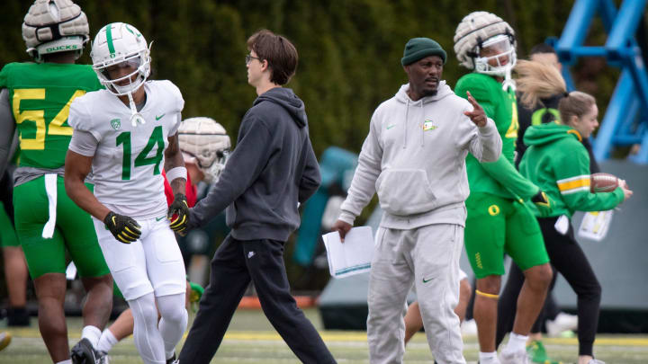 Oregon co-offensive coordinator Junior Adams walks the field during practice with the Oregon Ducks Saturday, April 6, 2024 at the Hatfield-Dowlin Complex in Eugene, Ore.