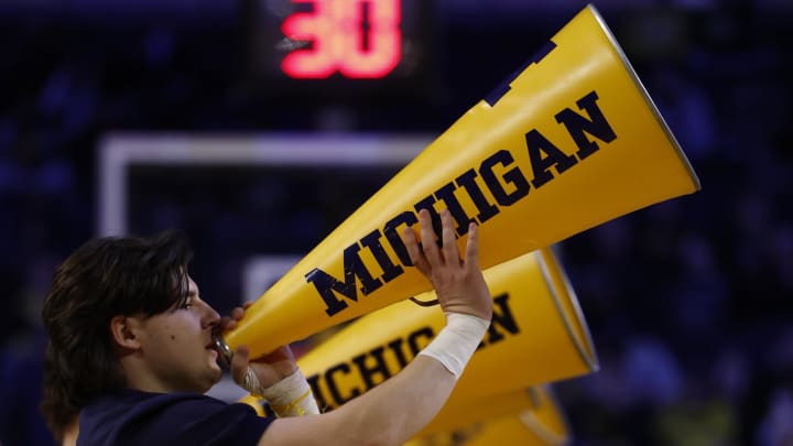 Mar 10, 2024; Ann Arbor, Michigan, USA;  Michigan Wolverines cheerleader cheer during a time out in the second half against the Nebraska Cornhuskers at Crisler Center. Mandatory Credit: Rick Osentoski-USA TODAY Sports