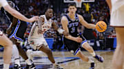 Mar 22, 2025; Denver, CO, USA; Brigham Young Cougars guard Egor Demin (3) dribbles the ball past Wisconsin Badgers guard John Blackwell (25) during the second half in the second round of the NCAA Tournament  at Ball Arena. Mandatory Credit: Isaiah J. Downing-Imagn Images