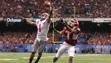 Jan 4, 2011; New Orleans, LA, USA; Ohio State Buckeye cornerback Devon Torrence (1) defends against Arkansas Razorbacks receiver Jarius Wright (4) in the third quarter during the 2011 Sugar Bowl at the Louisiana Superdome . Mandatory Credit: Matthew Emmons-USA TODAY Sports