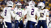 Nov 28, 2025; Tempe, Arizona, USA; Arizona Wildcats defensive back Treydan Stukes (2) celebrates with Ayden Garnes (9), Dalton Johnson (43) and Genesis Smith (12) after an interception against Arizona State Sun Devils in the second half during the 99th Territorial Cup at Mountain America Stadium. Mandatory Credit: Mark J. Rebilas-Imagn Images