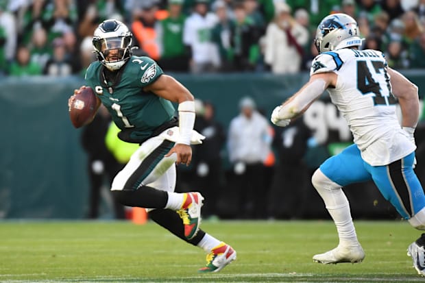 Philadelphia Eagles quarterback Jalen Hurts (1) is pressured by Carolina Panthers linebacker Josey Jewell