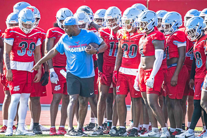 Delaware State University team members practice drills as they open preseason practice. 
