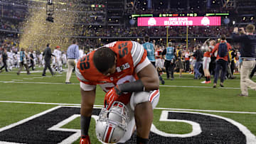 Jan 12, 2015; Arlington, TX, USA; Ohio State Buckeyes defensive lineman Donovan Munger (52) reacts to the win over Oregon Ducks in the 2015 CFP National Championship Game at AT&T Stadium. Ohio State won 42-20.  Mandatory Credit: Kirby Lee-Imagn Images