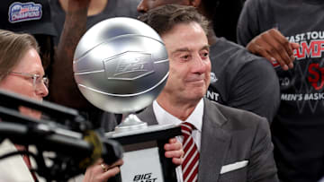 Mar 15, 2025; New York, NY, USA; Big East Conference commissioner Val Ackerman (left) hands the championship trophy to St. John's Red Storm head coach Rick Pitino after St. John's basketball defeated the Creighton Bluejays to win the Big East Tournament at Madison Square Garden.