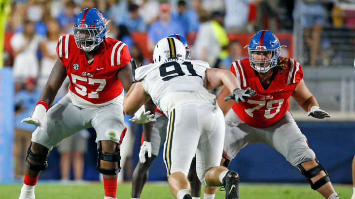 Oct 28, 2023; Oxford, Mississippi, USA; Mississippi Rebels offensive linemen Micah Pettus (57) and Jeremy James (78) block Vanderbilt Commodores defensive linemen Christian James (91) during the first half at Vaught-Hemingway Stadium. Mandatory Credit: Petre Thomas-USA TODAY Sports