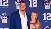 Jun 12, 2024; Foxborough, MA, USA; Retired NFL tight end Rob Gronkowski poses for photos with his girlfriend Camille Kostek during the New England Patriots Hall of Fame induction Ceremony for Tom Brady Mandatory Credit: Eric Canha-Imagn Images