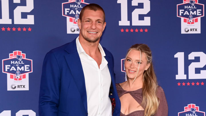 Jun 12, 2024; Foxborough, MA, USA; Retired NFL tight end Rob Gronkowski poses for photos with his girlfriend Camille Kostek during the New England Patriots Hall of Fame induction Ceremony for Tom Brady Mandatory Credit: Eric Canha-USA TODAY Sports