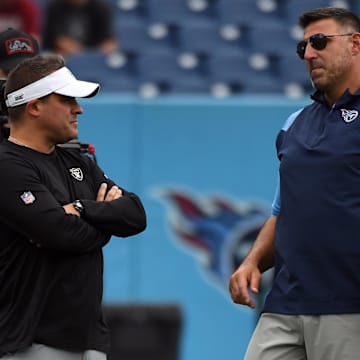 Sep 25, 2022; Nashville, Tennessee, USA; Las Vegas Raiders head coach Josh McDaniels (left) talks with Tennessee Titans head coach Mike Vrabel (right) before the game at Nissan Stadium. Mandatory Credit: Christopher Hanewinckel-Imagn Images