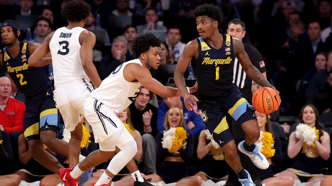 Mar 13, 2025; New York, NY, USA; Marquette Golden Eagles guard Kam Jones (1) controls the ball against Xavier Musketeers guard Dayvion McKnight (20) during the second half at Madison Square Garden. Mandatory Credit: Brad Penner-Imagn Images