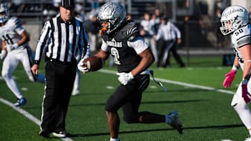 Harrisburg running back Messiah Mickens breaks free on an 89-yard touchdown run in the second half of a District 3 Class 6A quarterfinal game against Dallastown