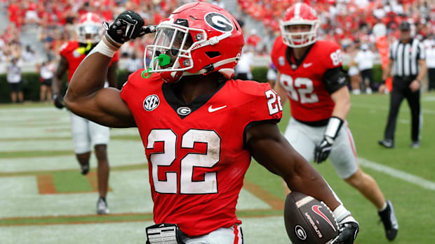 Georgia running back Branson Robinson celebrates after scoring a touchdown.