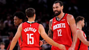 Oct 27, 2025; Houston, Texas, USA; Houston Rockets center Steven Adams (12) talks with Houston Rockets guard Reed Sheppard (15) after the first quarter against the Brooklyn Nets at Toyota Center. Mandatory Credit: Erik Williams-Imagn Images