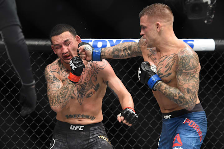 Max Holloway fights Dustin Poirier during UFC 236 at State Farm Arena. 