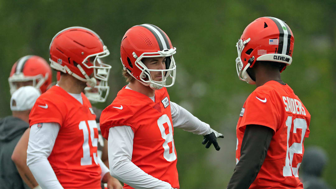 Cleveland Browns quarterback Kenny Pickett gestures to rookie Shedeur Sanders during an NFL practice at the Cleveland Browns training facility on Wednesday, May 28, 2025, in Berea, Ohio.