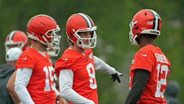 Cleveland Browns quarterback Kenny Pickett gestures to rookie Shedeur Sanders during an NFL practice at the Cleveland Browns training facility on Wednesday, May 28, 2025, in Berea, Ohio.