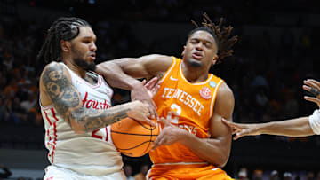 Mar 30, 2025; Indianapolis, IN, USA; Houston Cougars guard Emanuel Sharp (21) steals the ball from Tennessee Volunteers guard Chaz Lanier (2) in the second half during the Midwest Regional final of the 2025 NCAA tournament at Lucas Oil Stadium. Mandatory Credit: Trevor Ruszkowski-Imagn Images