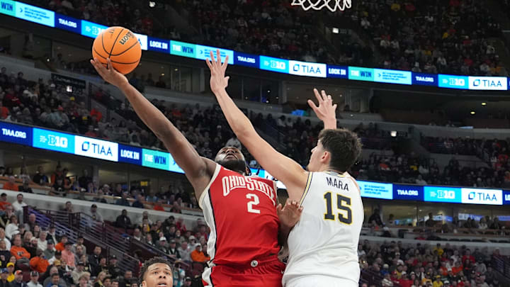 Mar 13, 2026; Chicago, IL, USA; Michigan Wolverines center Aday Mara (15) defends Ohio State Buckeyes guard Bruce Thornton (2) during the second half at United Center. Mandatory Credit: David Banks-Imagn Images