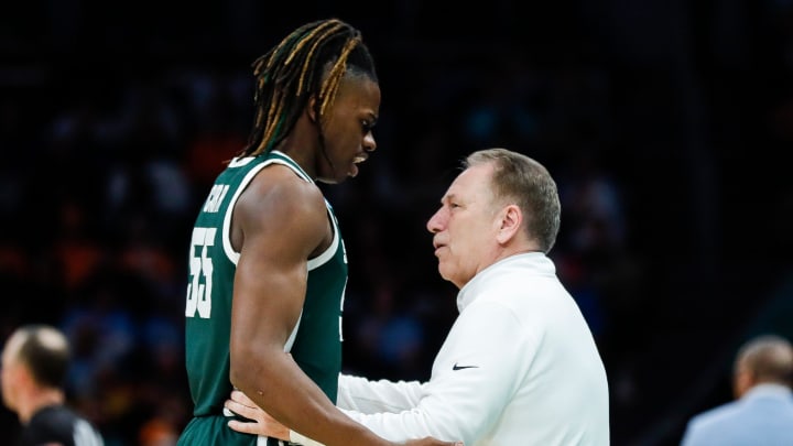 Michigan State head coach Tom Izzo talks to forward Coen Carr (55) during the second half of the NCAA tournament West Region second round against North Carolina at Spectrum Center in Charlotte, N.C. on Saturday, March 23, 2024.